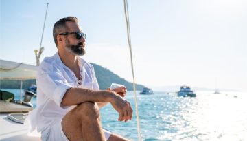 Man on Boat with Alcoholic Beverage